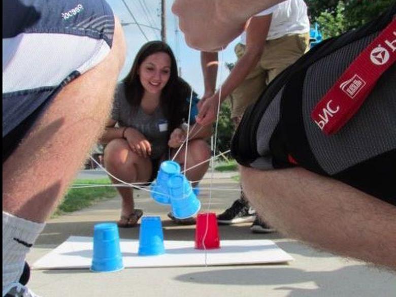 Students playing a game with cups